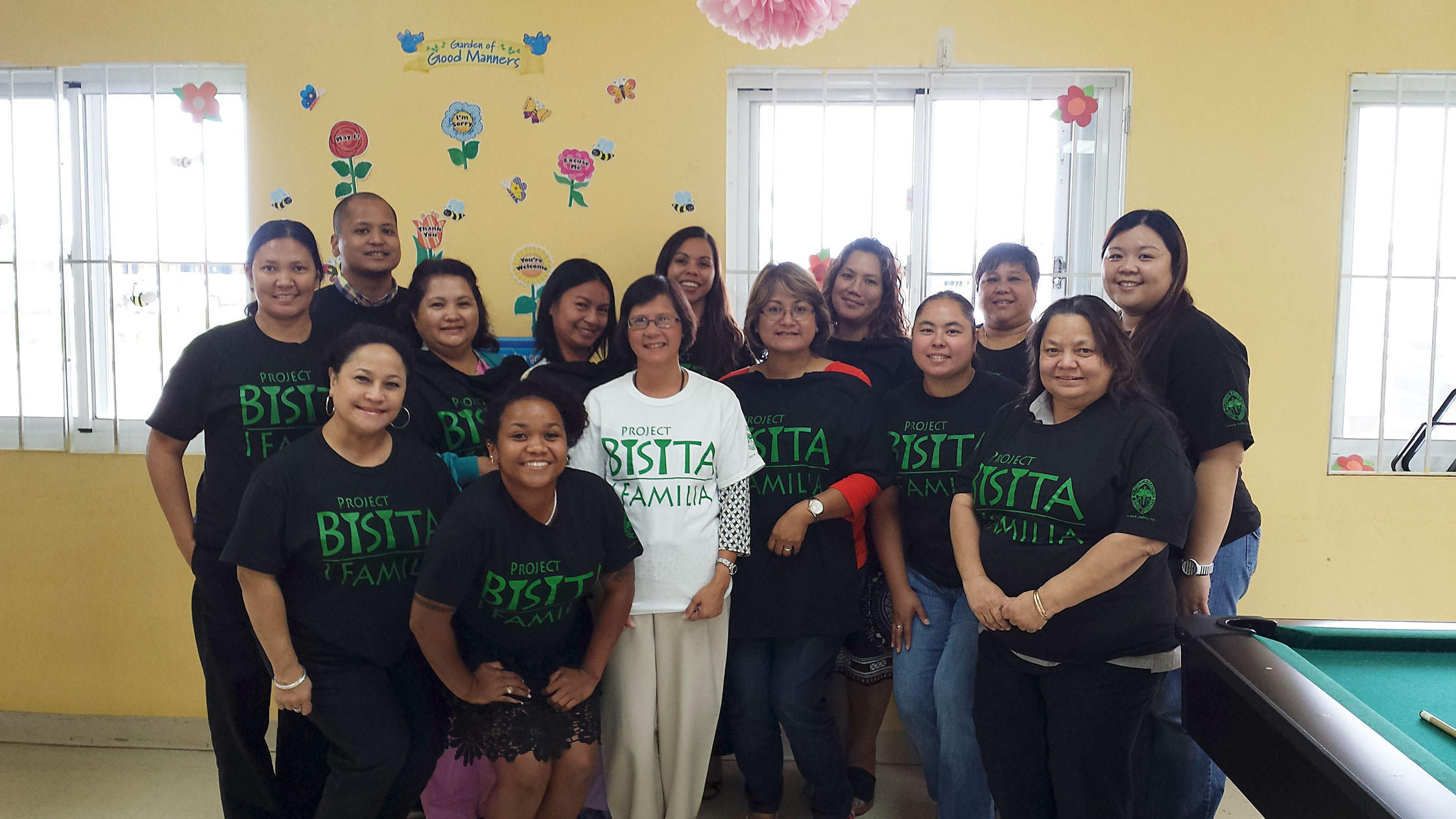 Group wearing Project Bisita T-shirts posing for photo.
