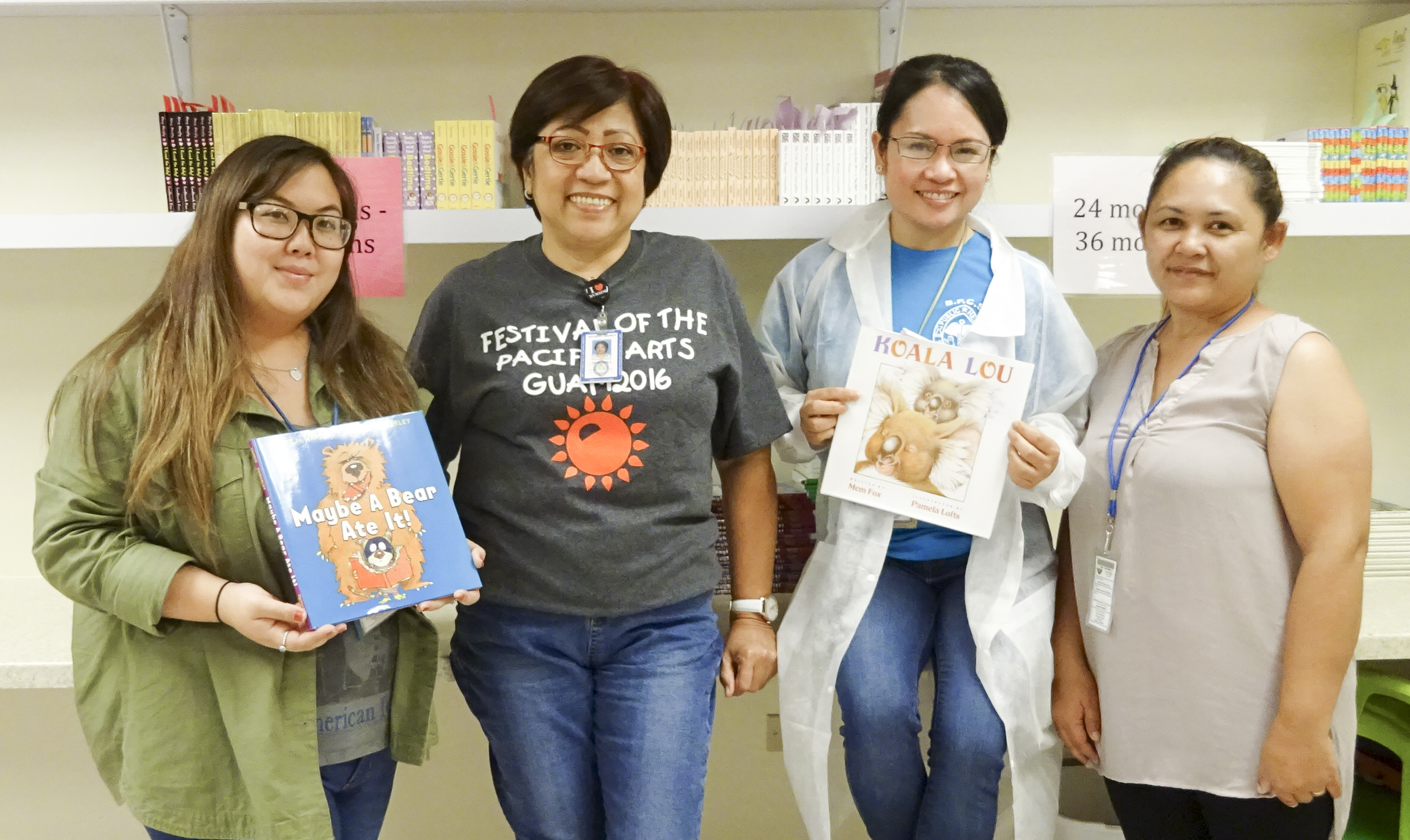 Jenika Ballesta, Guam CEDDERS (far left), and Coleen Dela Cruz, Guam CEDDERS (far right), presented books to the staff of Southern Region Community Health Center on July 1 as part of the Reach Out and Read Program.
