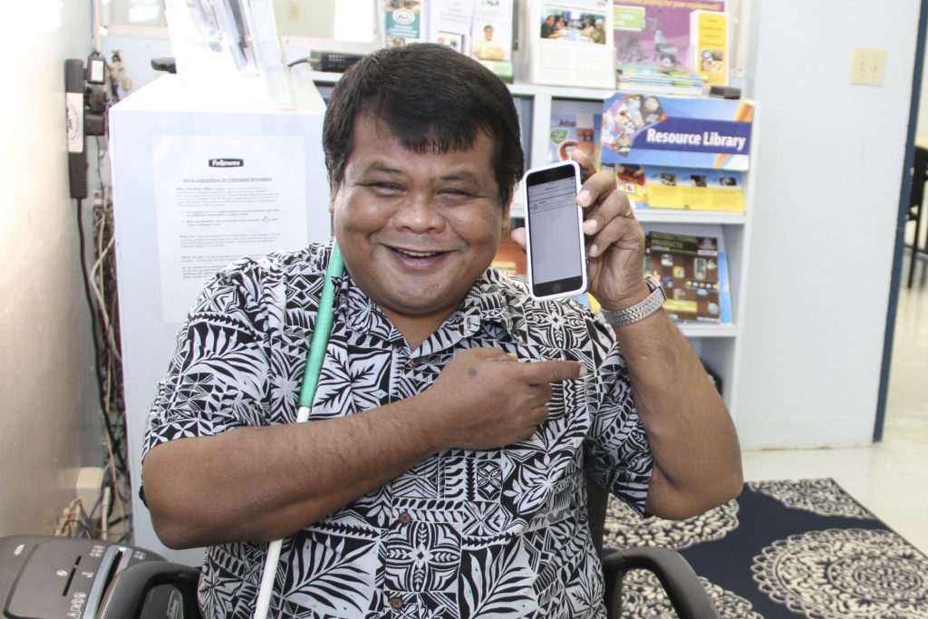Frank Ungacta holds up new iPhone 6s.