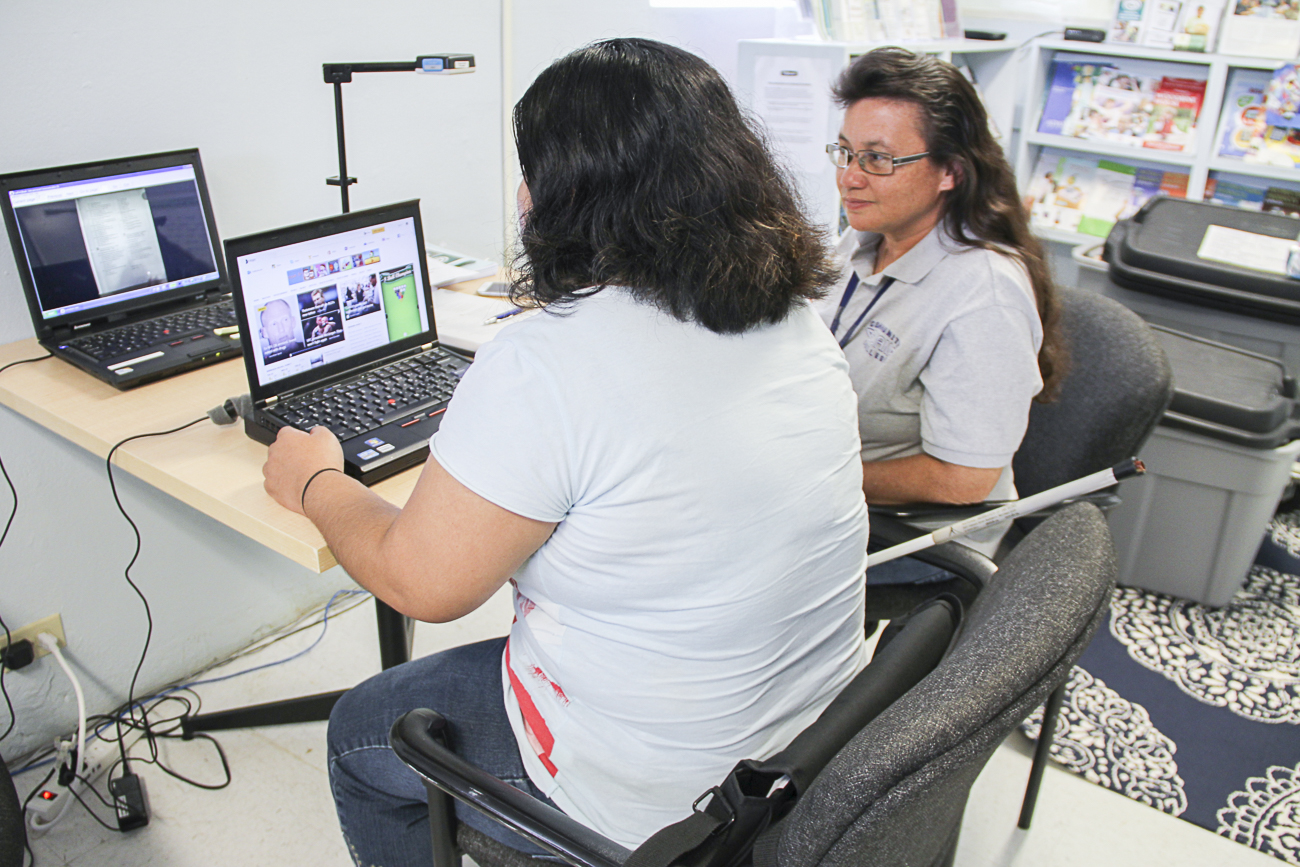 On August 24, Leah Abelon, GSAT AT Center, demonstrated the use of Eyepal to Finia Kachita (left), a student from the Guam Community College (GCC), and Kimberly Bautista, GCC Acomodative Services (right). Eyepal is an assistive technology tool that converts printed text into speech.