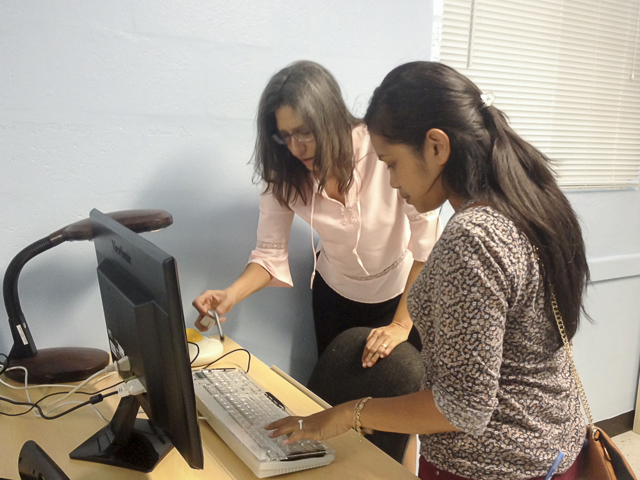 On August 17, Nancy Swamy, a case manager at Westcare Pacific Islands Inc., and Clarissa Wilson (right) explored various Assistive Technology options that can be used in their organization to facilitate access for their clients.